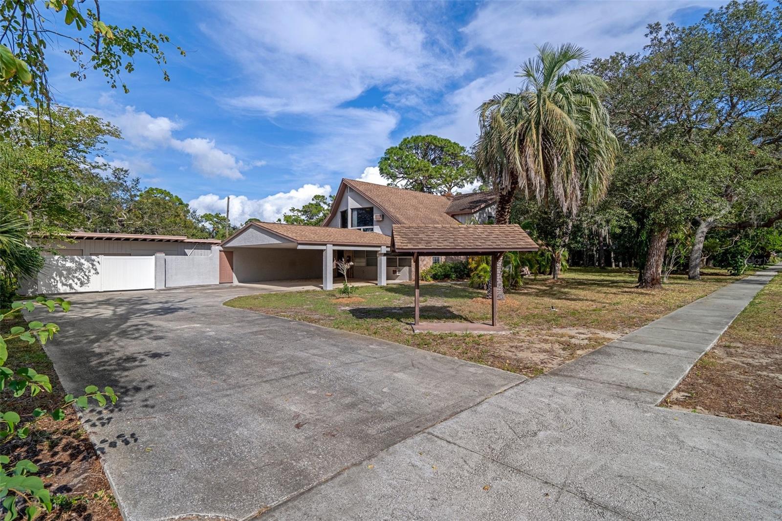 Gated entry to back yard and detached garage/workshop