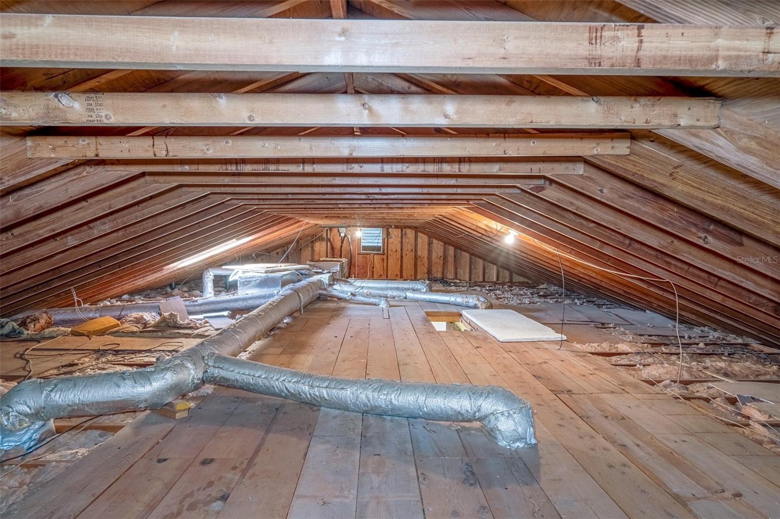 attic above primary suite with subfloor