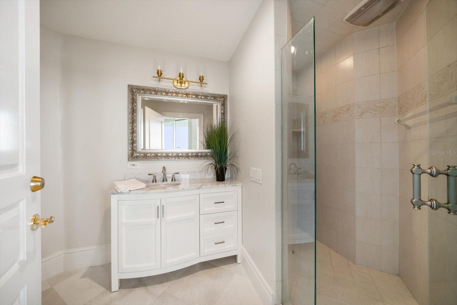 Fourth bedroom/office private bath area with walk in shower