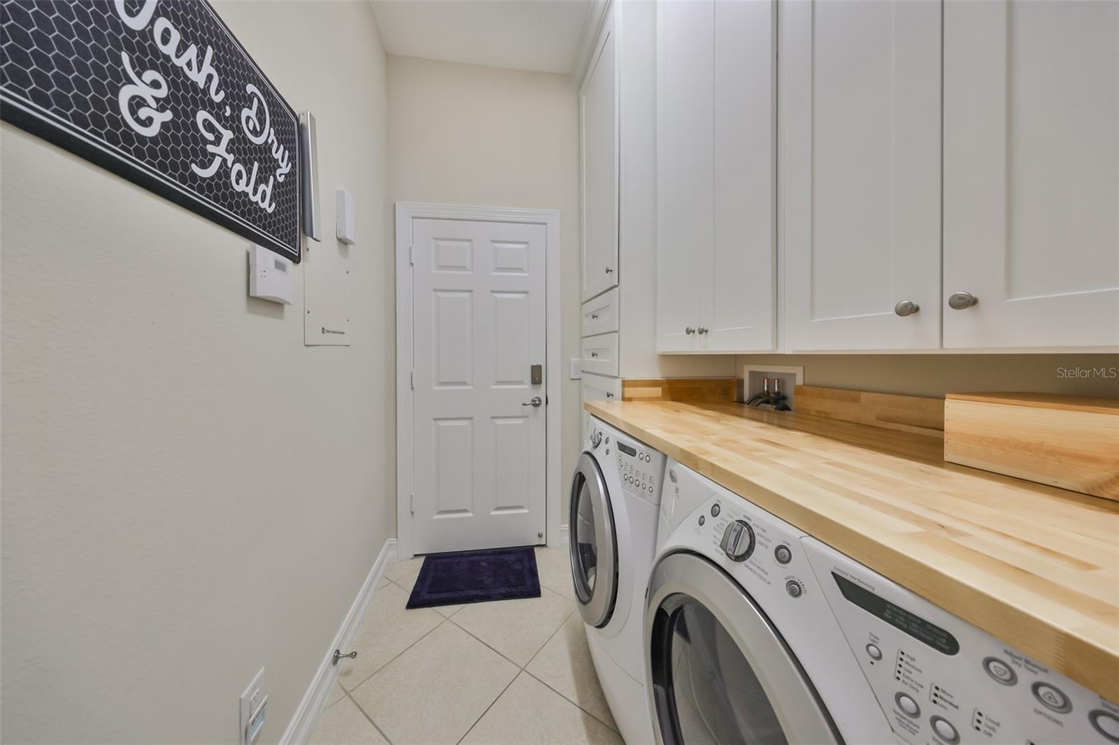 Laundry with tall cabinets