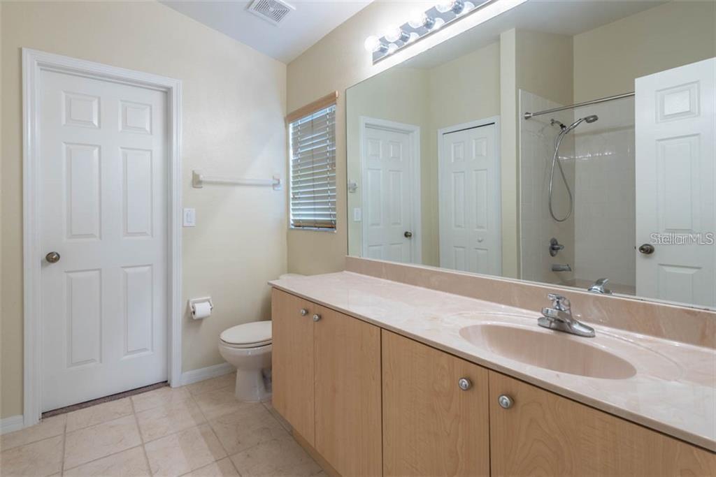 primary bathroom, with huge walk in closet