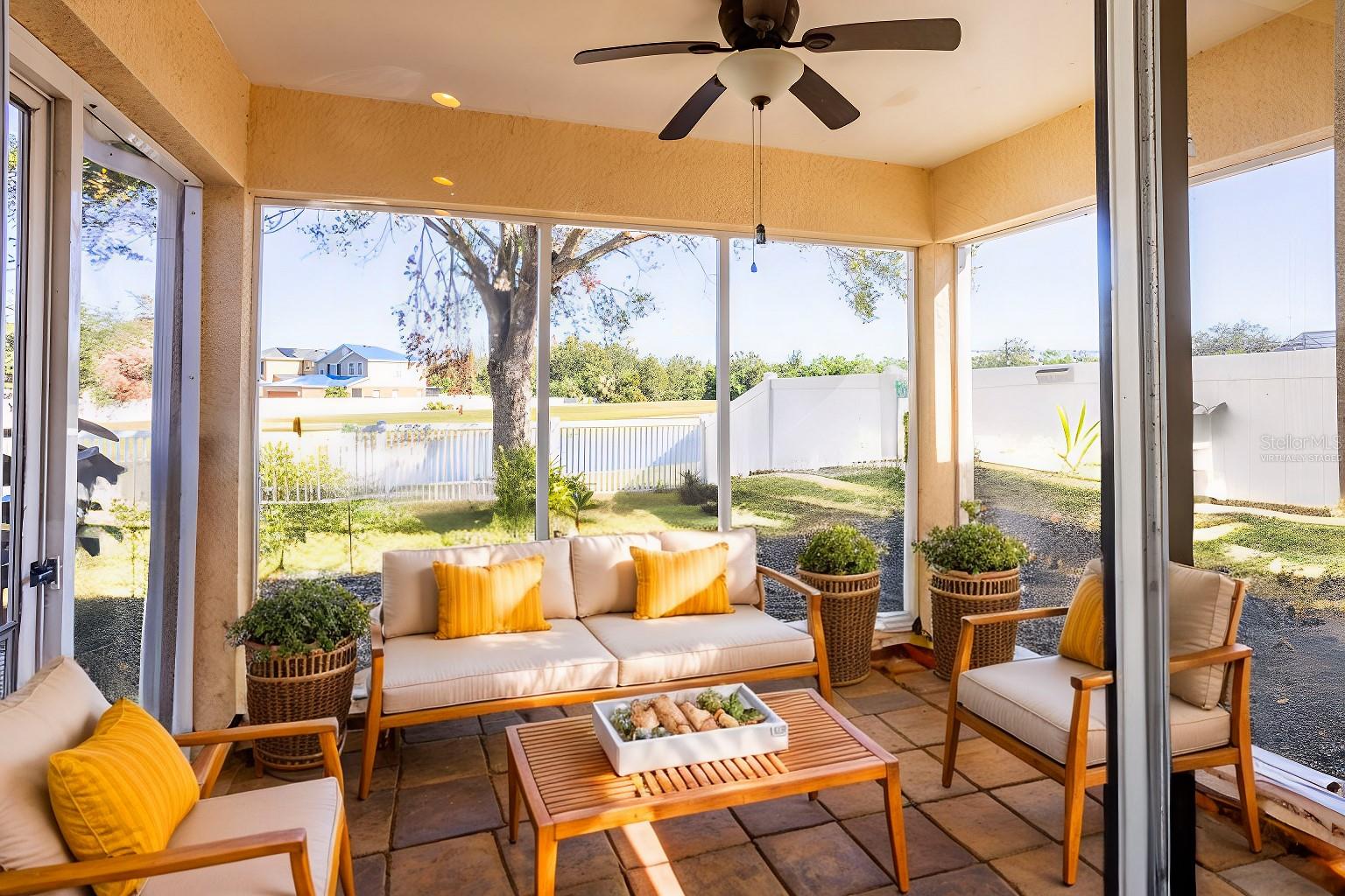 virtually staged outdoor patio with beautiful pond view