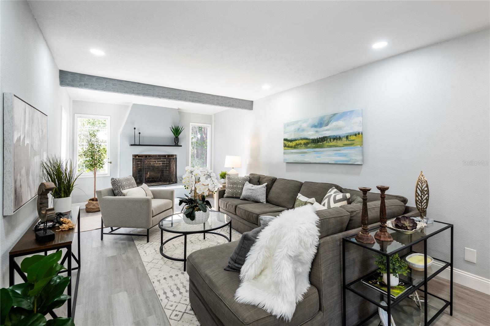 Family room with wood burning fireplace. Room for a sectional couch.