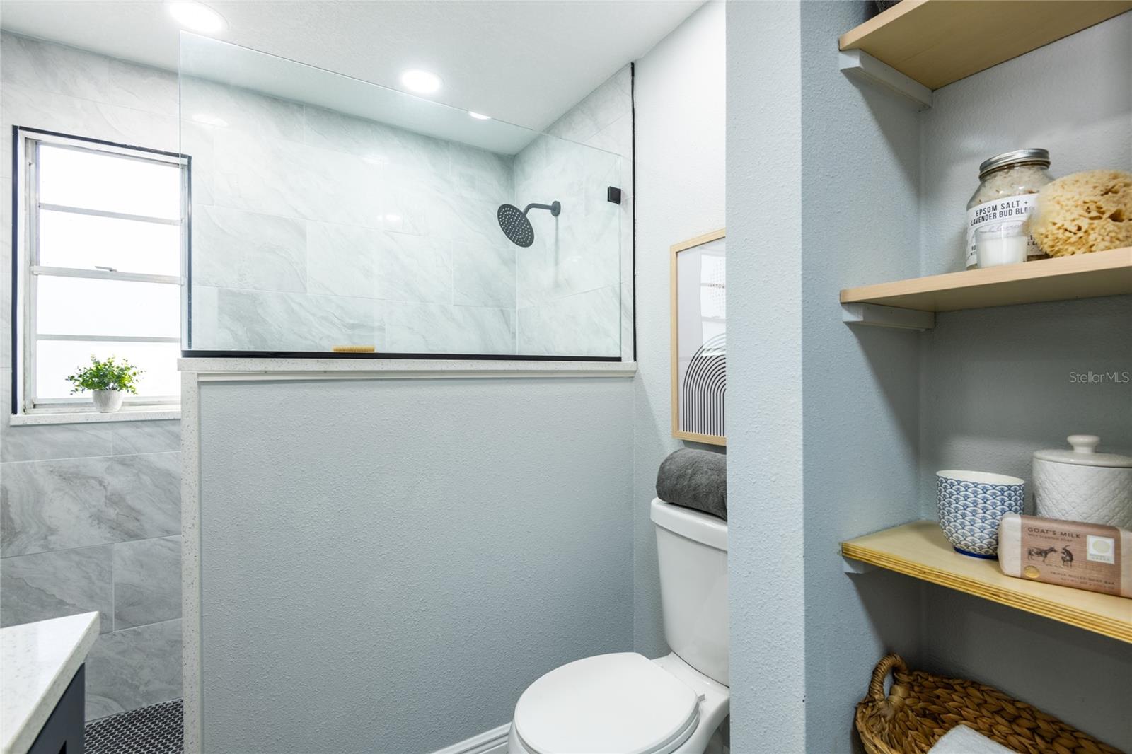 Upstairs full bathroom with beautiful shower.