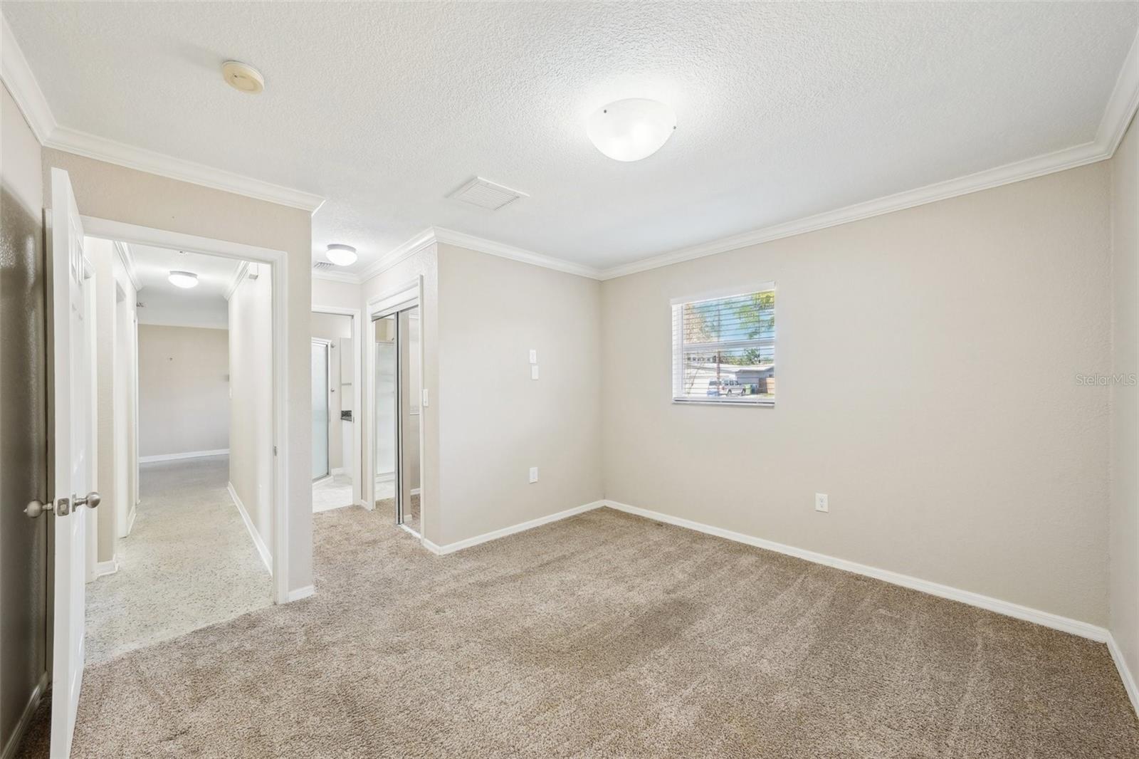 primary bedroom with ensuite bathroom