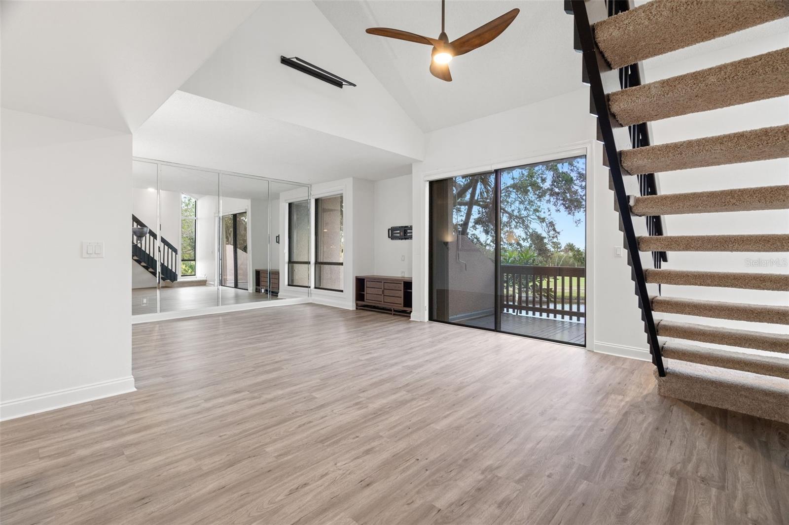 Stunning residence offers an open floor plan with soaring ceilings and contemporary upgrades throughout.