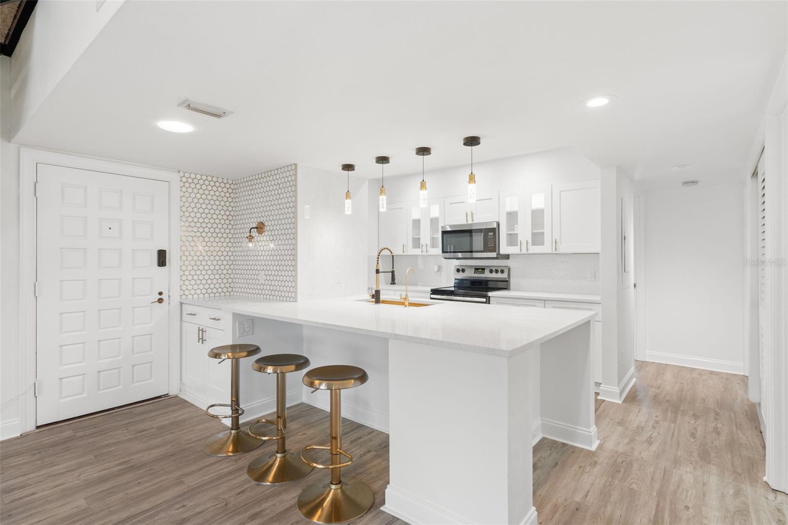 Kitchen opens to your living/dining areas.