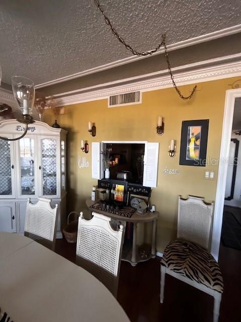 Dining area with pass-through window to kitchen and open to living room