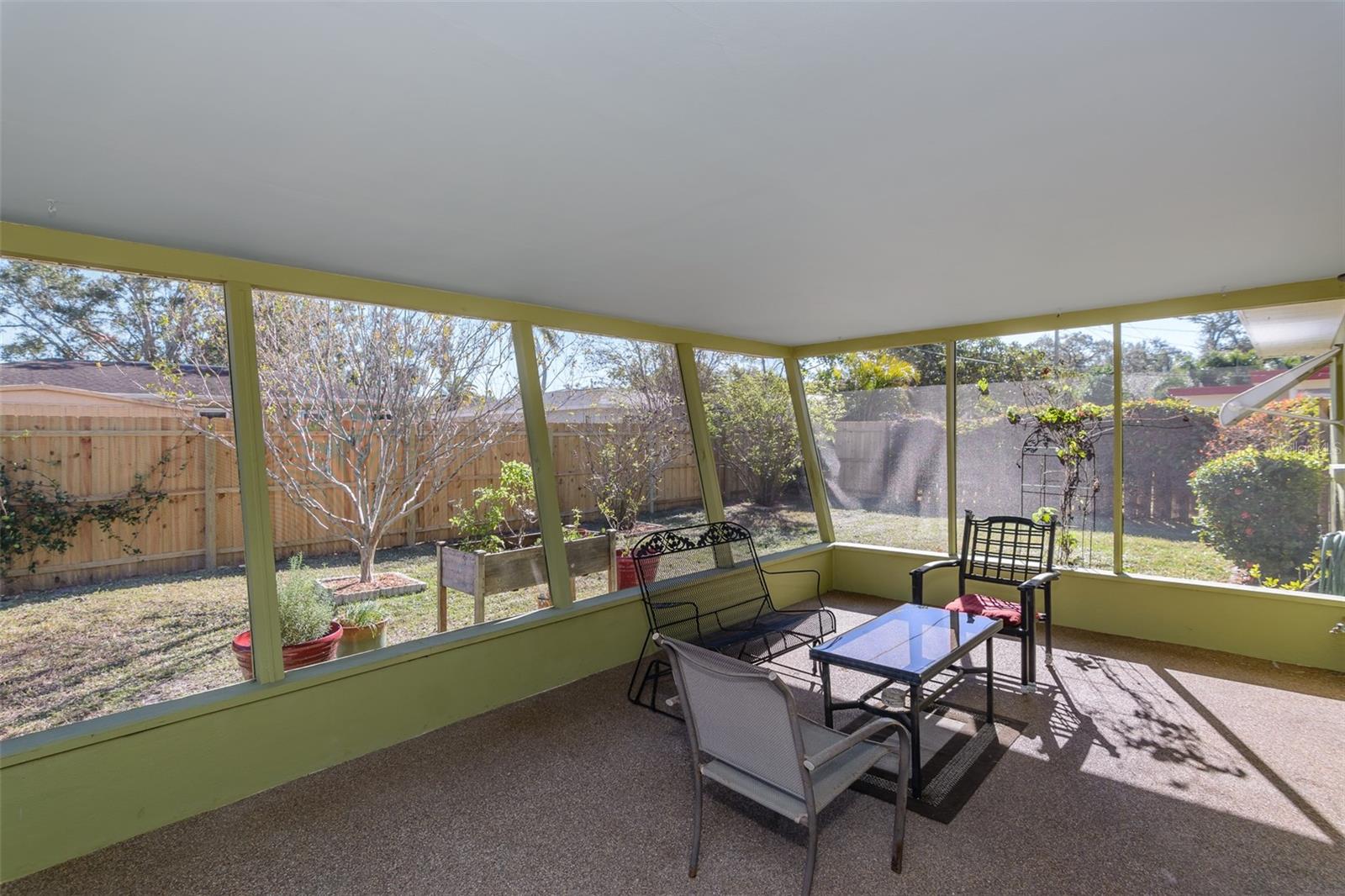 The screened patio is on the east side of the house for shade almost all day.