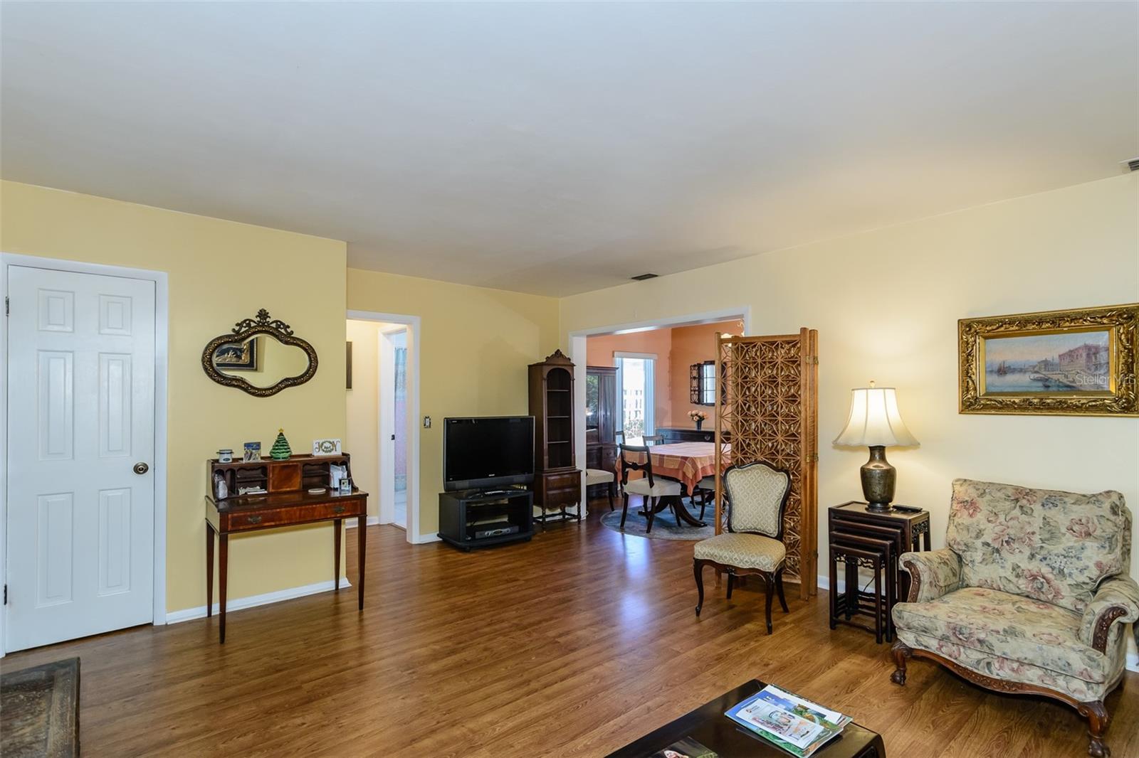 Enter into the living room with the dining room straight beyond.