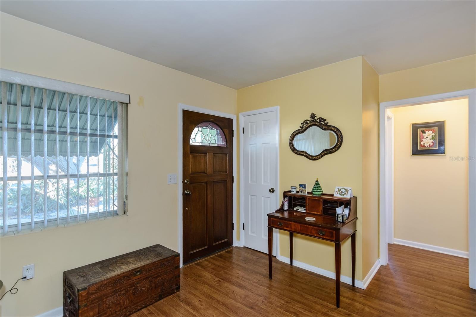 Solid wood doors have been placed throughout the home with a beveled glass window in the front door.