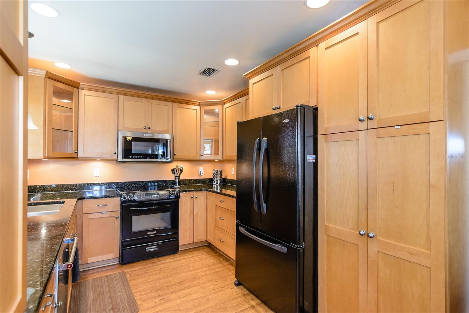 Solid maple cabinets and granite counter tops are the highlight of the kitchen.