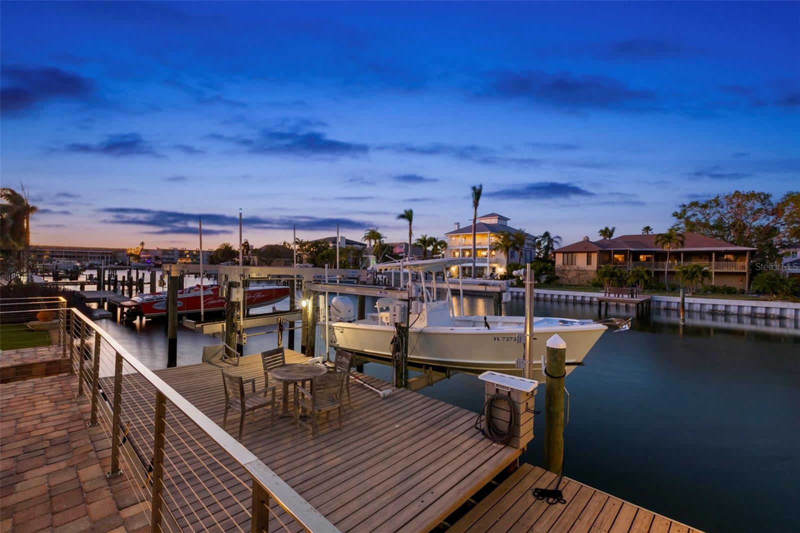 Expansive dock with two boat lifts.