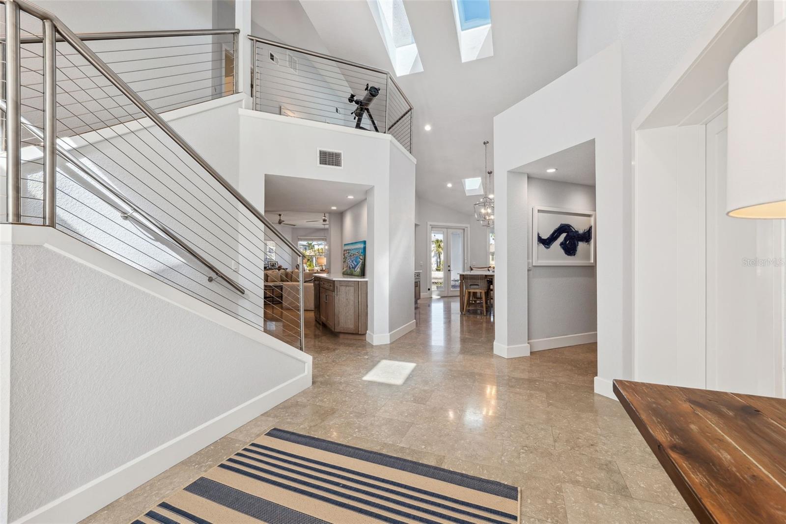 Exquisite entry with limestone flooring throughout the first floor living areas.