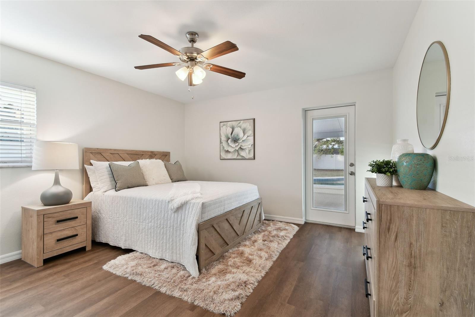 Master Bedroom with Half Bath and Door to Patio and Pool