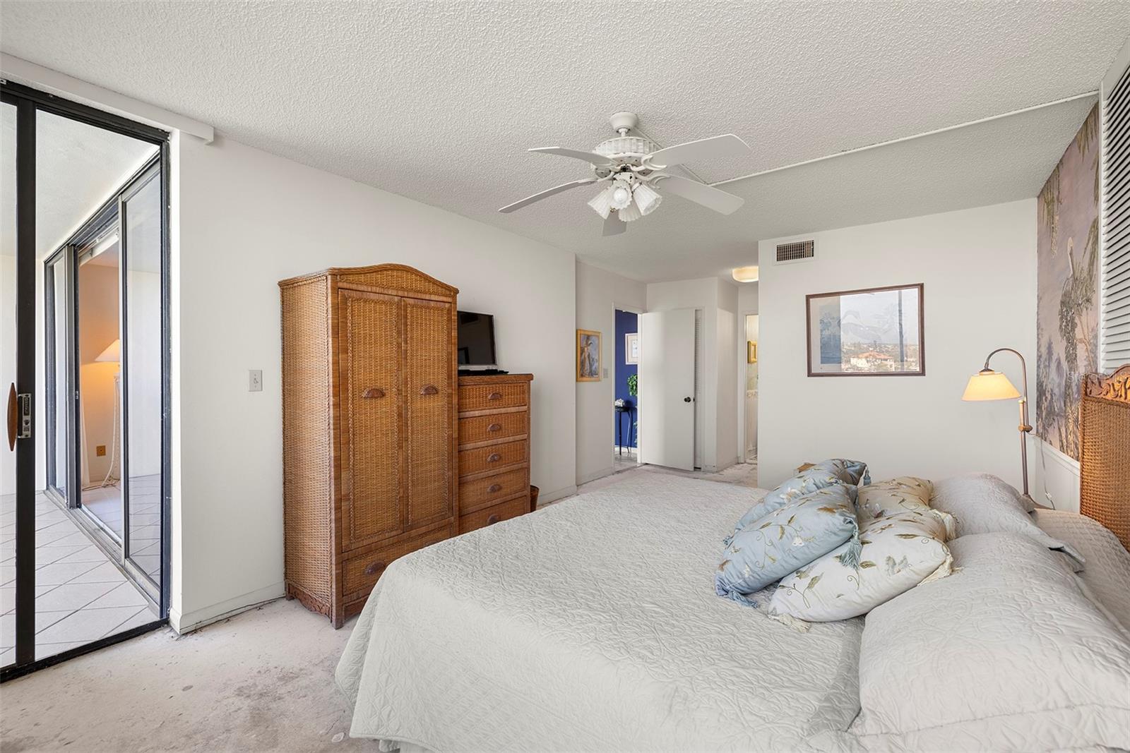 Spacious master bedroom has direct balcony access