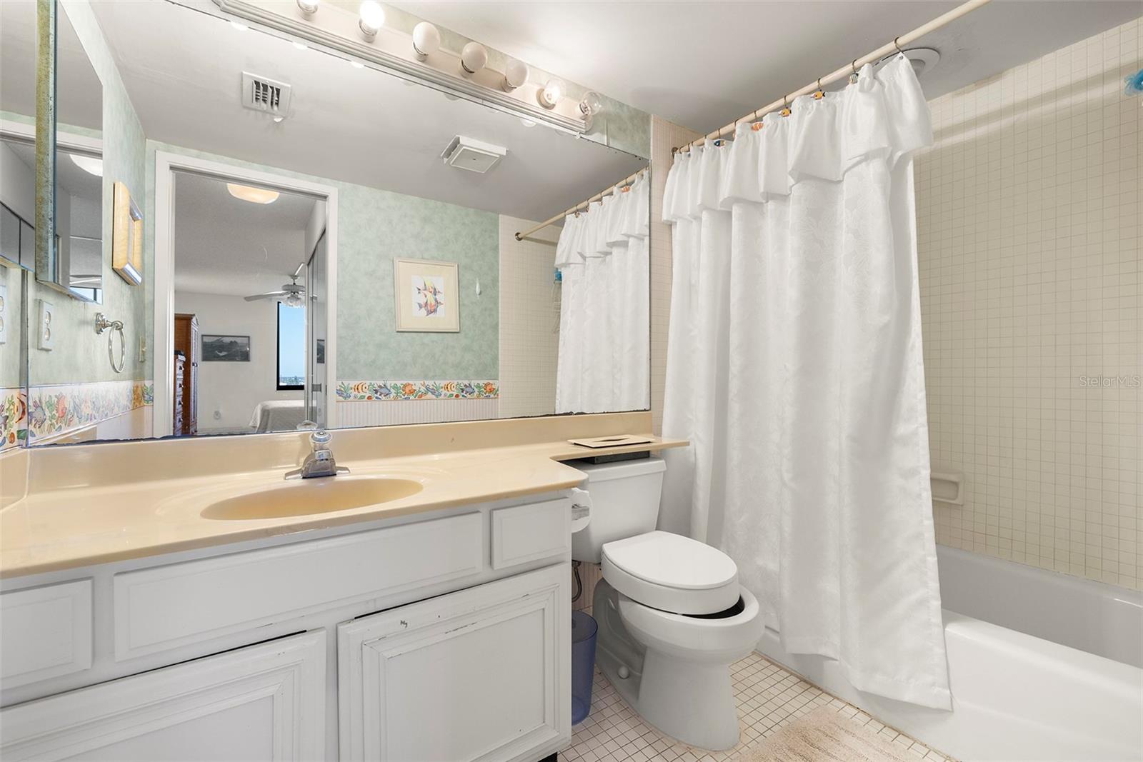 En-suite bathroom with a tub