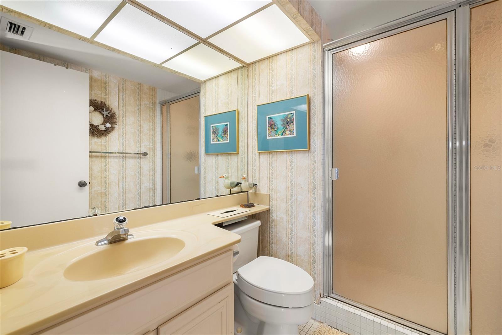 Well-maintained bathroom with potential for a fresh, updated look.