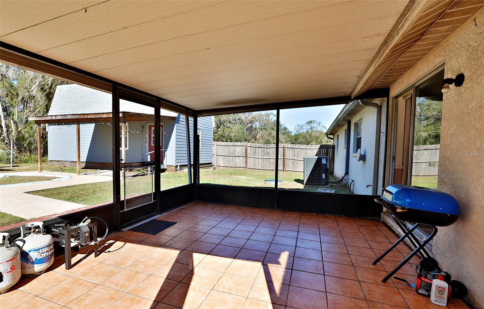 screened back porch (2nd dwelling in background)