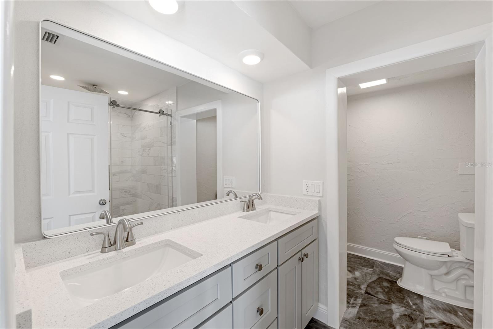 Downstairs renovated master bathroom