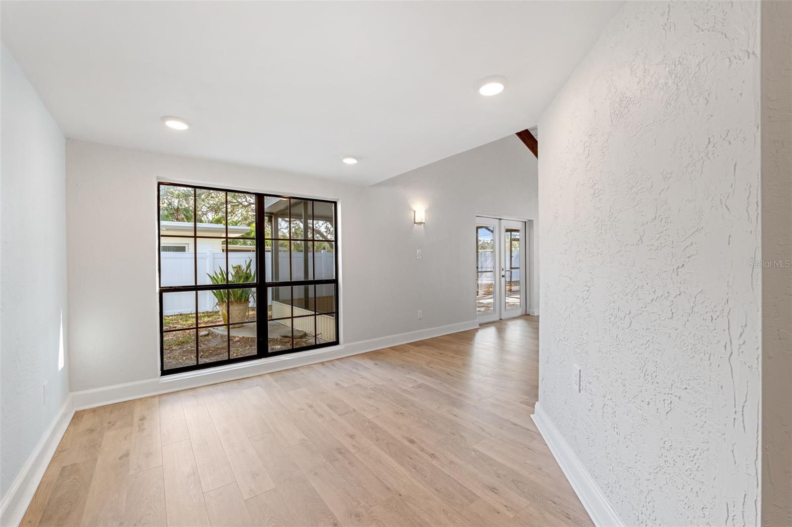 Dining room off of the kitchen leading to the rear living room.