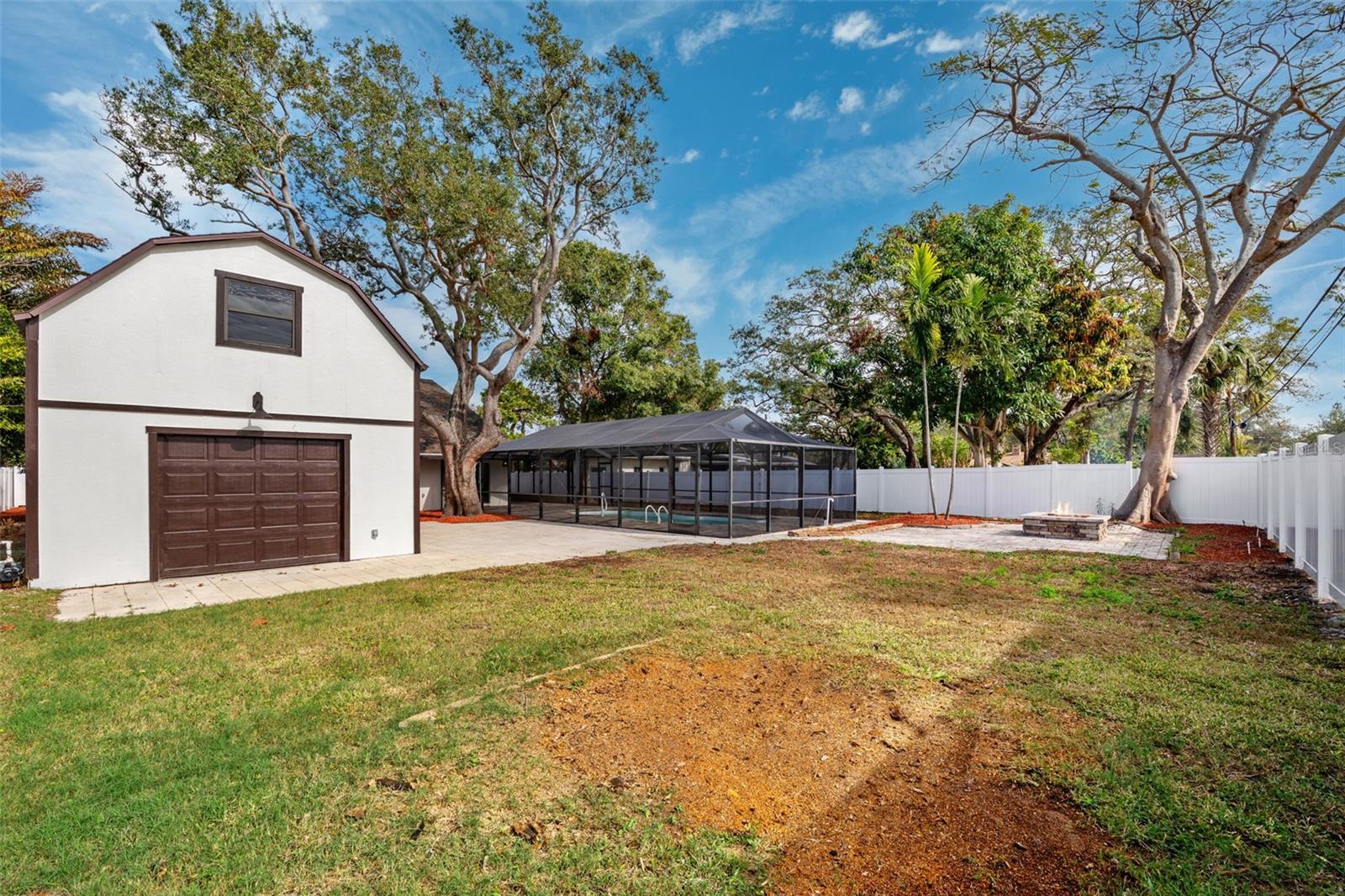 Backyard detached garage with alleyway access. Abundance of room for a playground, putting green, hot tub and more.