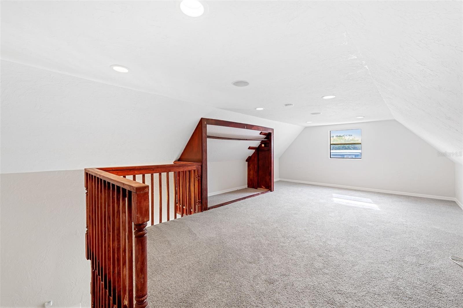 Second story temperature controlled loft bedroom in detached garage