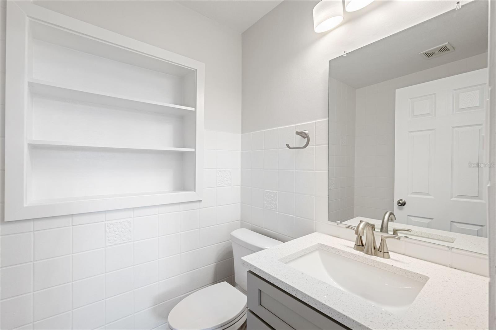 Guest full bathroom with tub shower