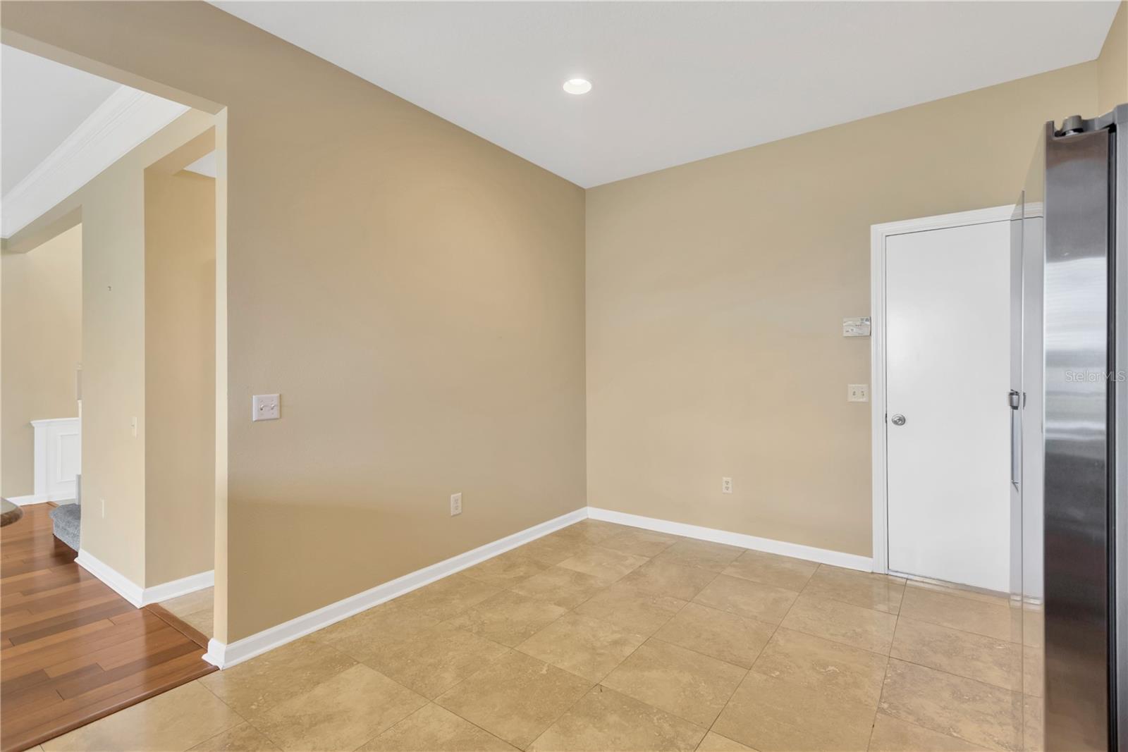 There is plenty of room inside the kitchen for a casual table or another run of cabinets or kitchen work island.