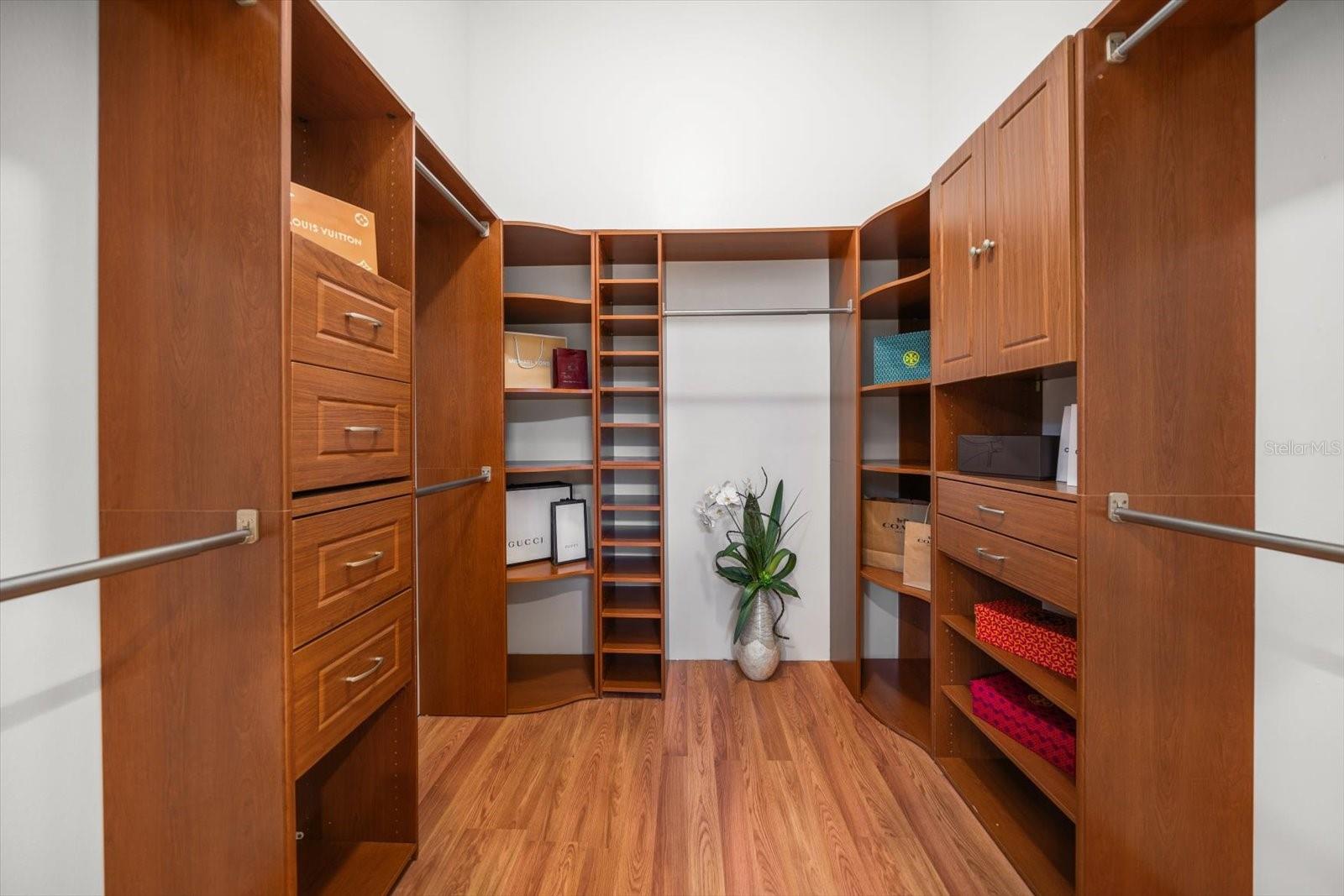 Outstanding custom walk in closet in primary bedroom