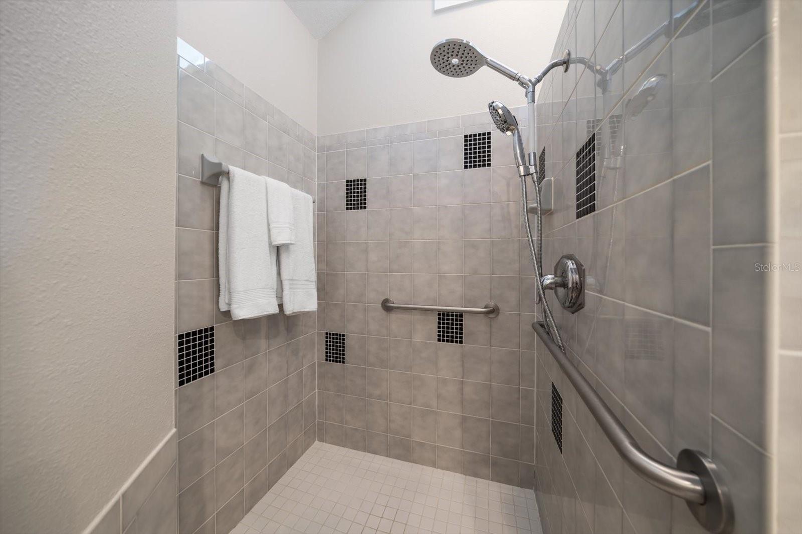 Walk in shower in Primary bedroom is impressive