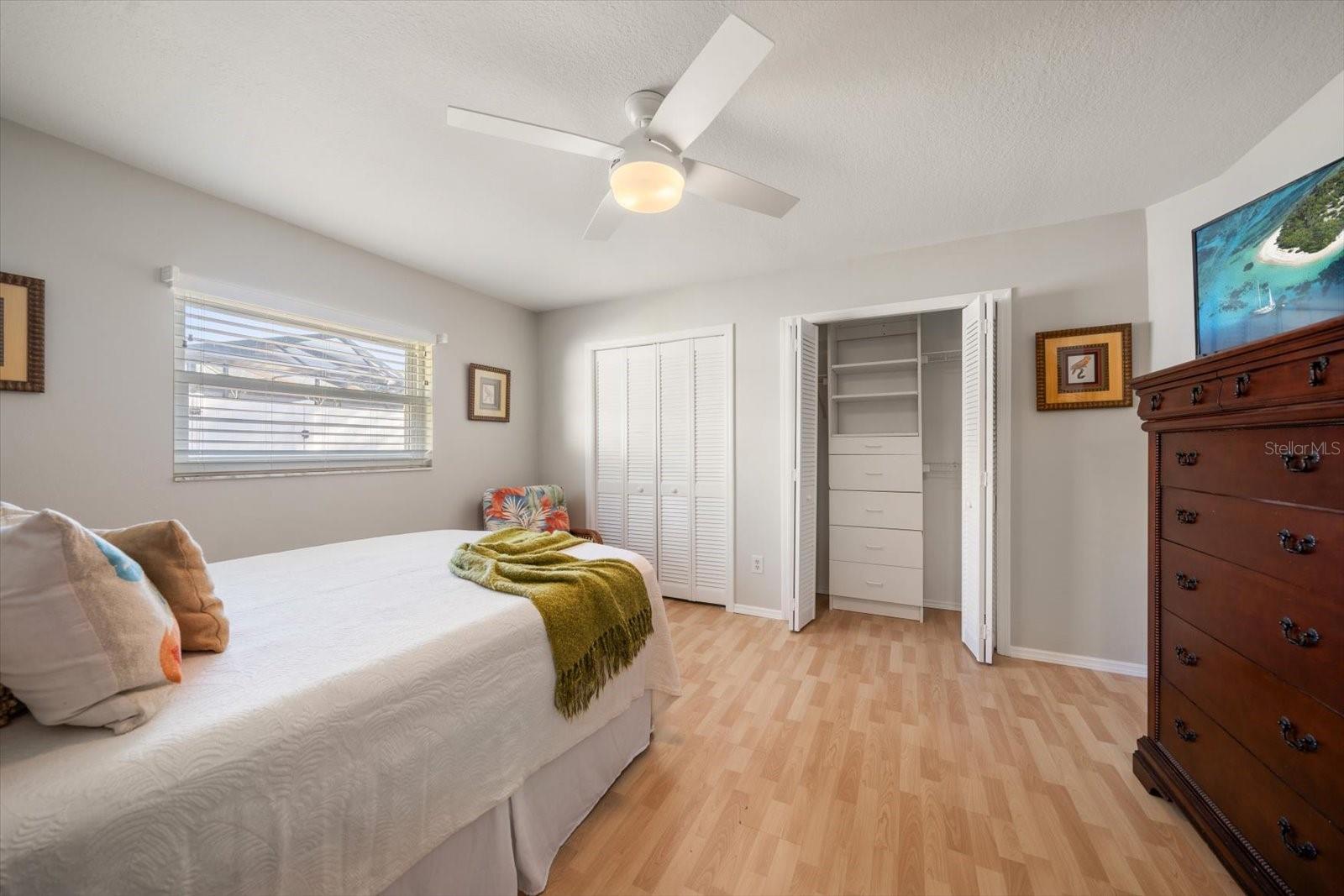 Bedroom 2 has custom built-ins in closet areas.