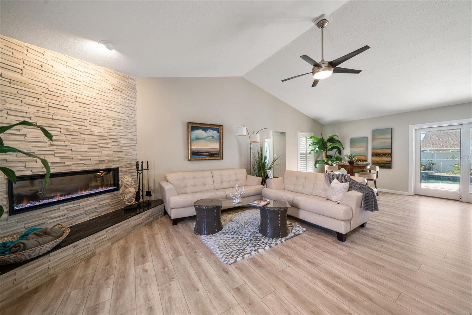 Family room area equipped with an electric fireplace- great mood setter!