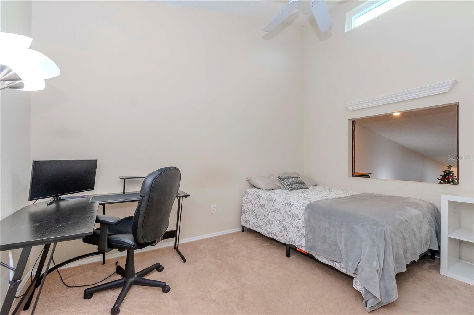 Second bedroom/loft area with opening that looks into main living area. This "window" can be closed to allow for privacy.