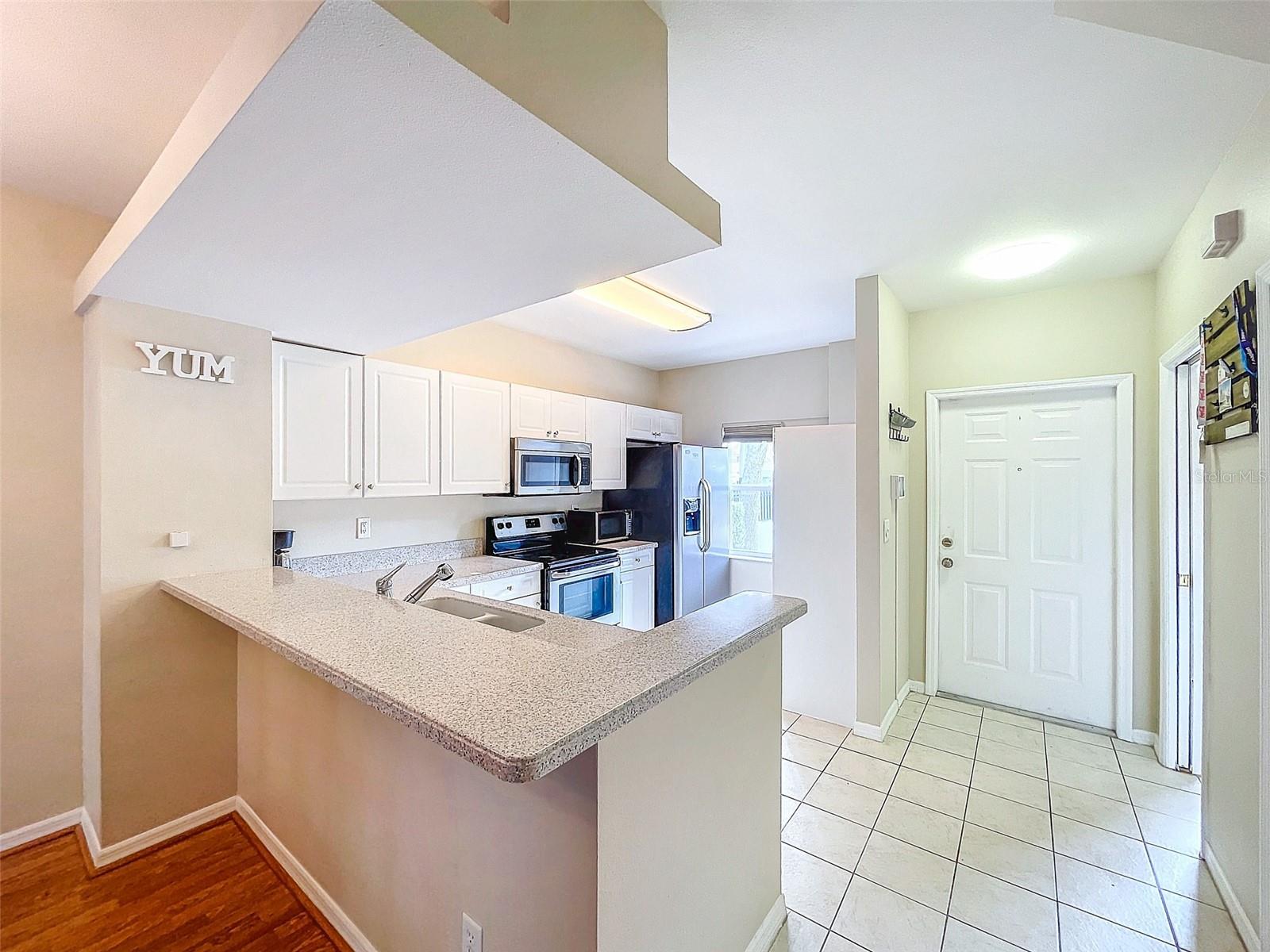 Foyer / Kitchen / Powder Room / 1/2 Bath