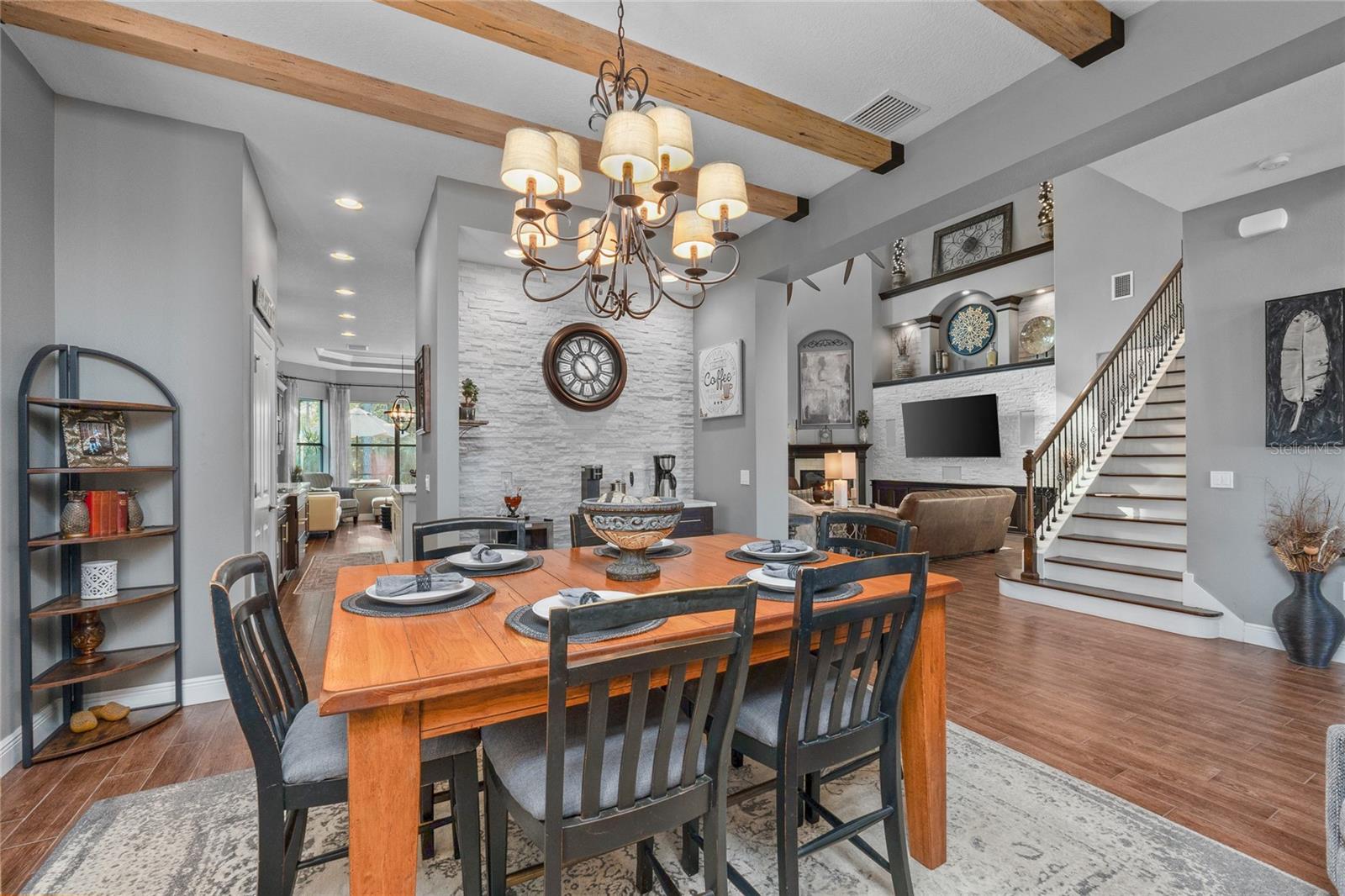 Stacked stone wall and gorgeous wood beam ceiling!