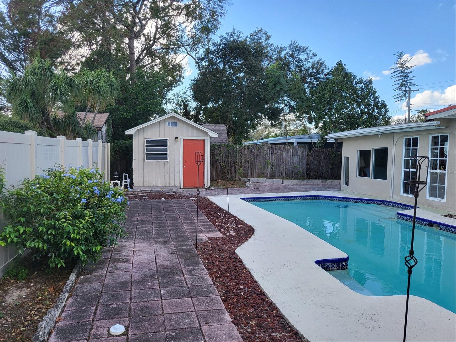 BACK YARD WITH STORAGE BLDG