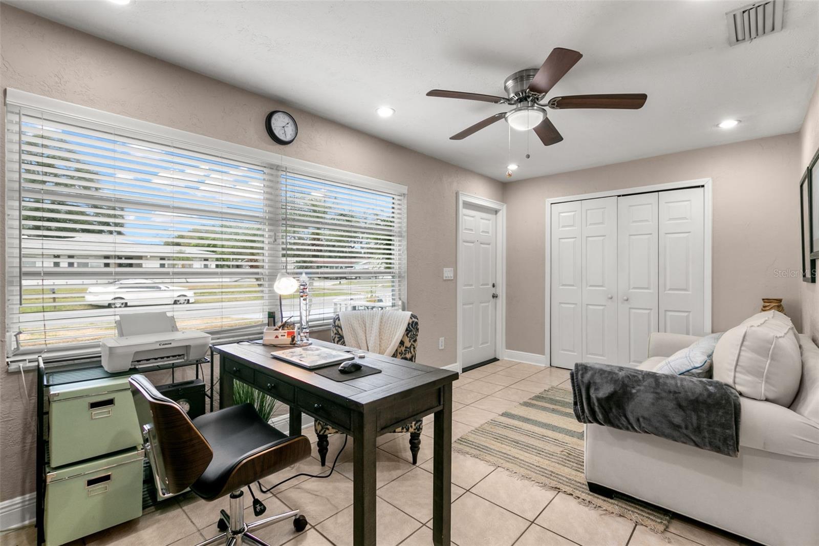 bedroom 3/office with exterior entrance and private gated wing porch