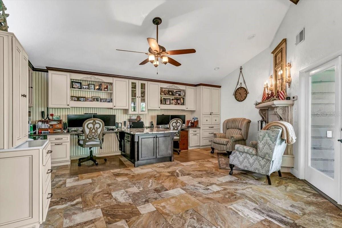 Customized study family room with wood burning fireplace