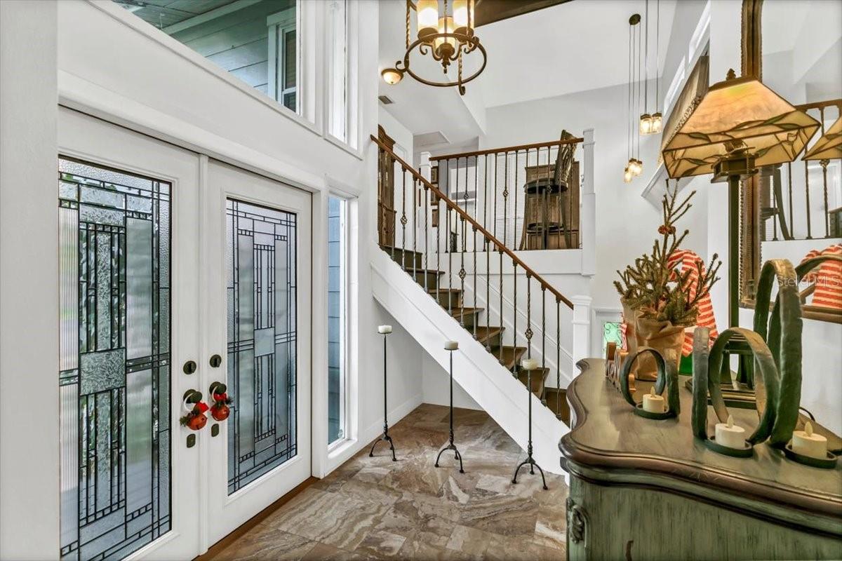 Front entry stairs m leading to bonus room and bathroom