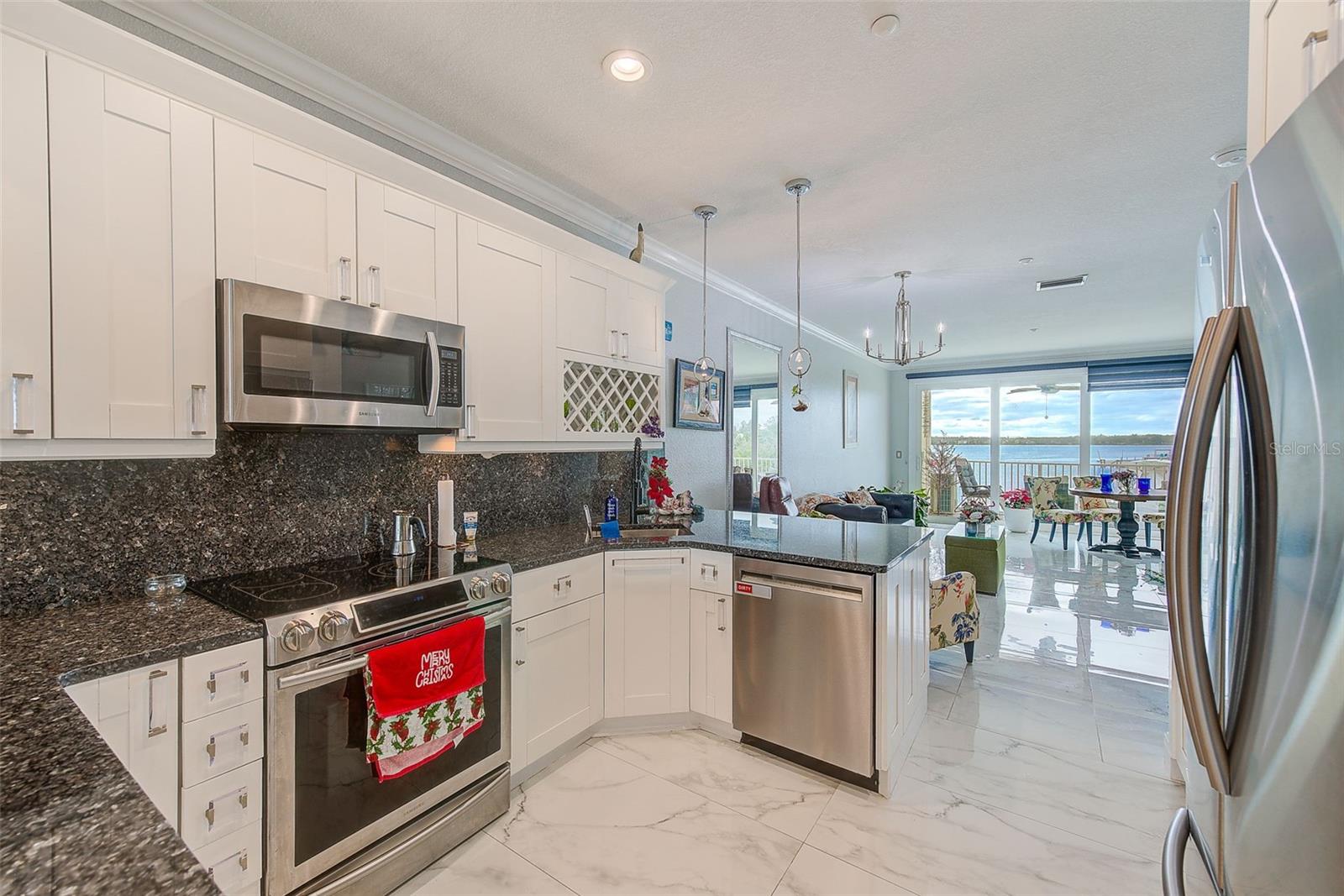 View of kitchen, living room, and dining room