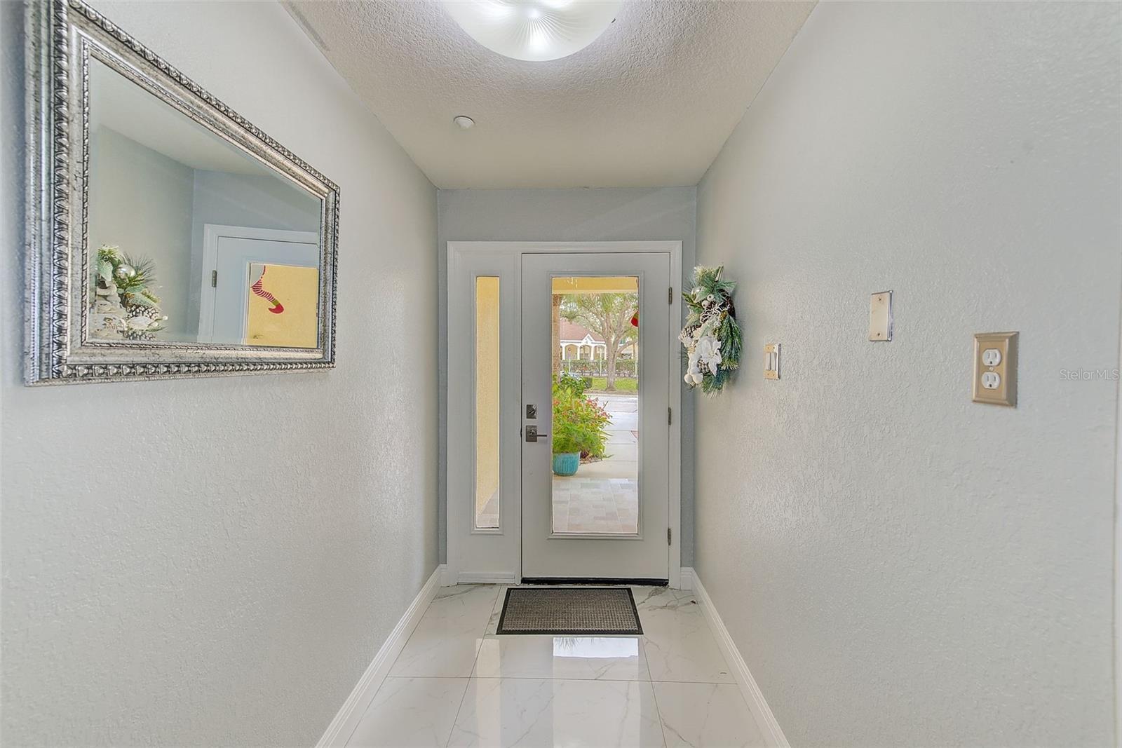 View of foyer leading to front door