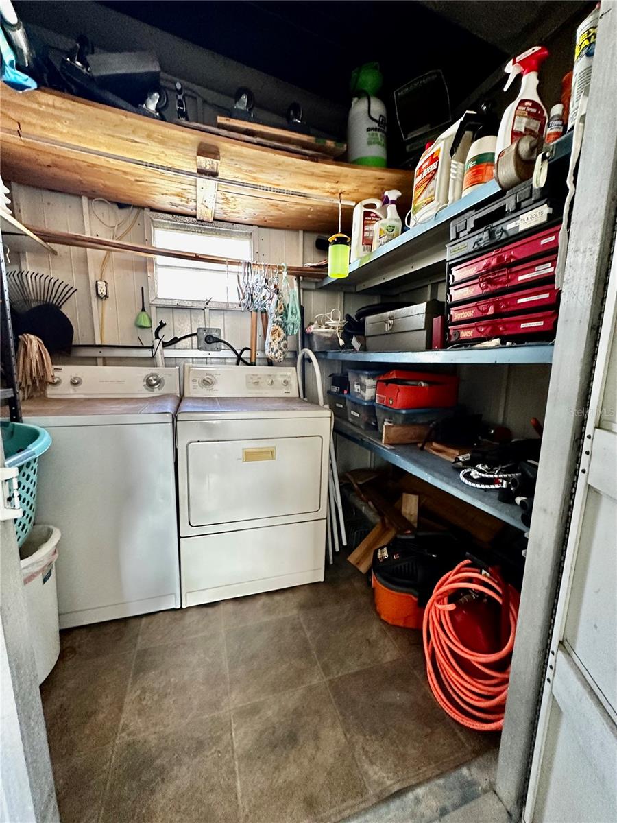 Storage and Laundry room with plenty of shelves