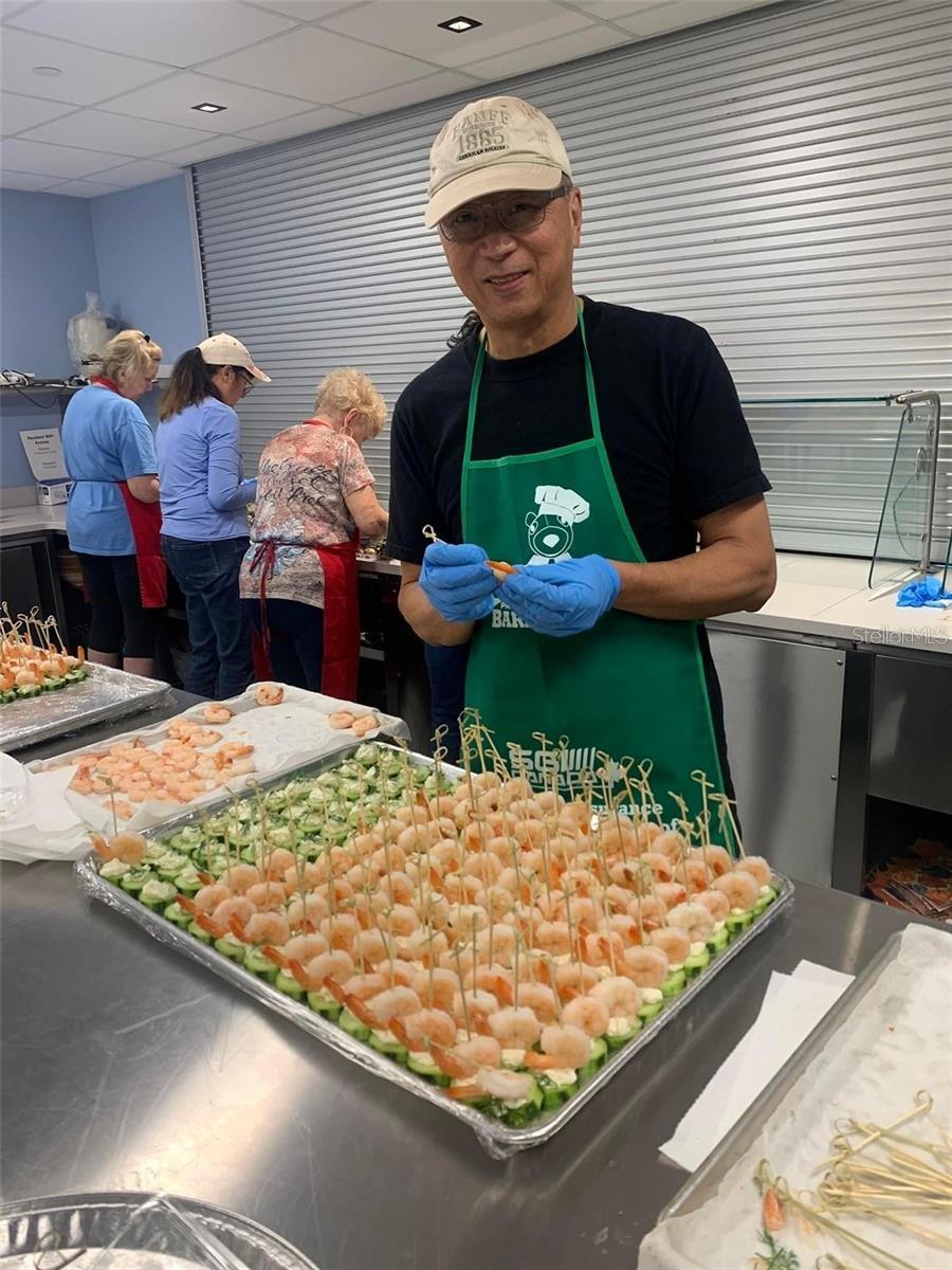 Volunteers helping with the party trays