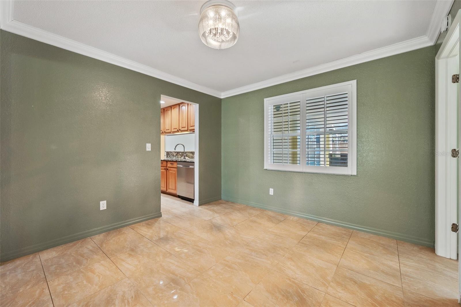 Dining room kitchen entry to left.