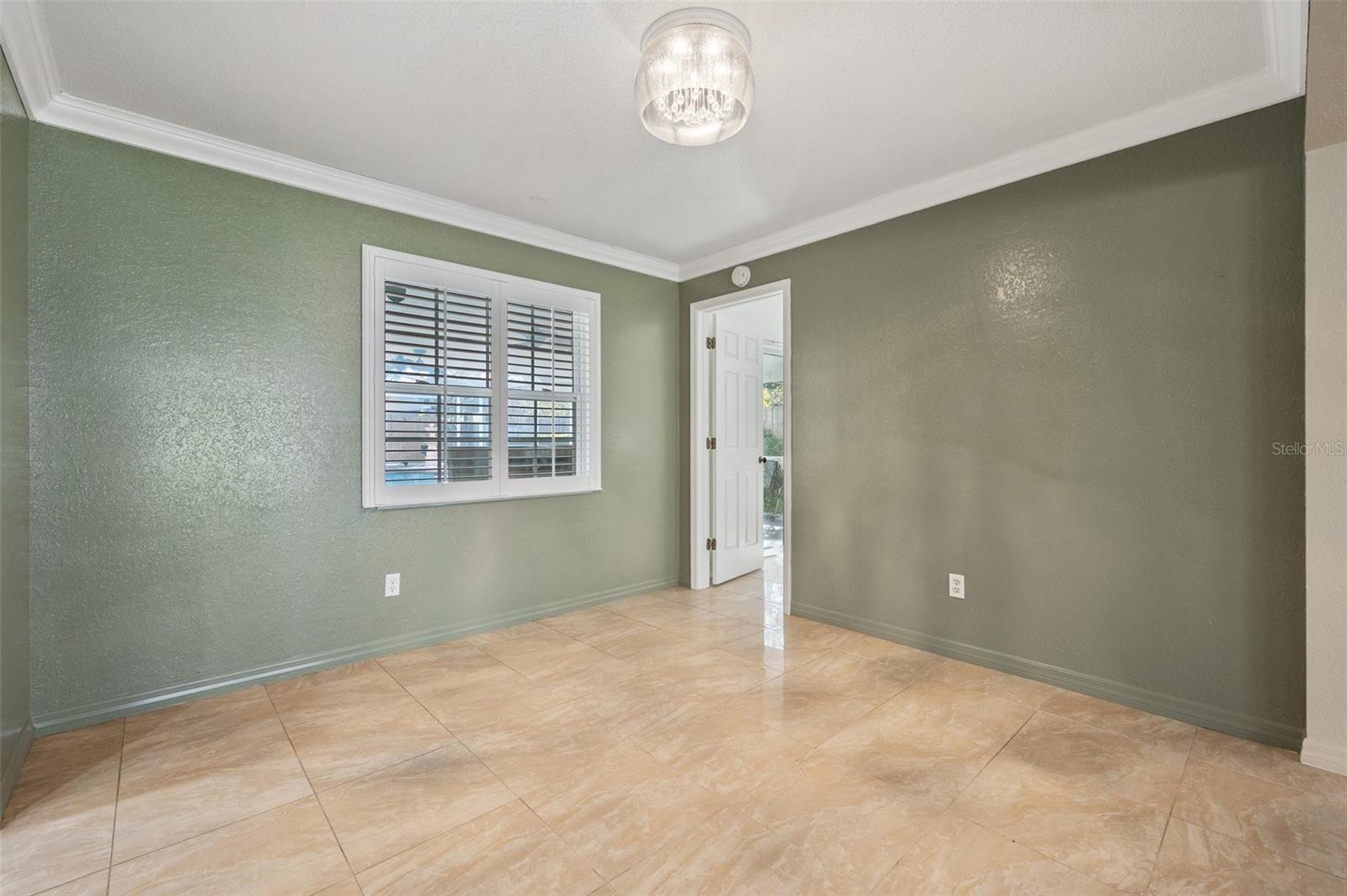 Dining room. Kitchen entry to the left, Master bedroom door to right.