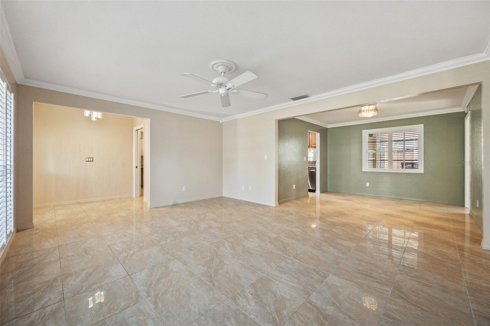 Living room looking to the front door on the left and kitchen to the top.