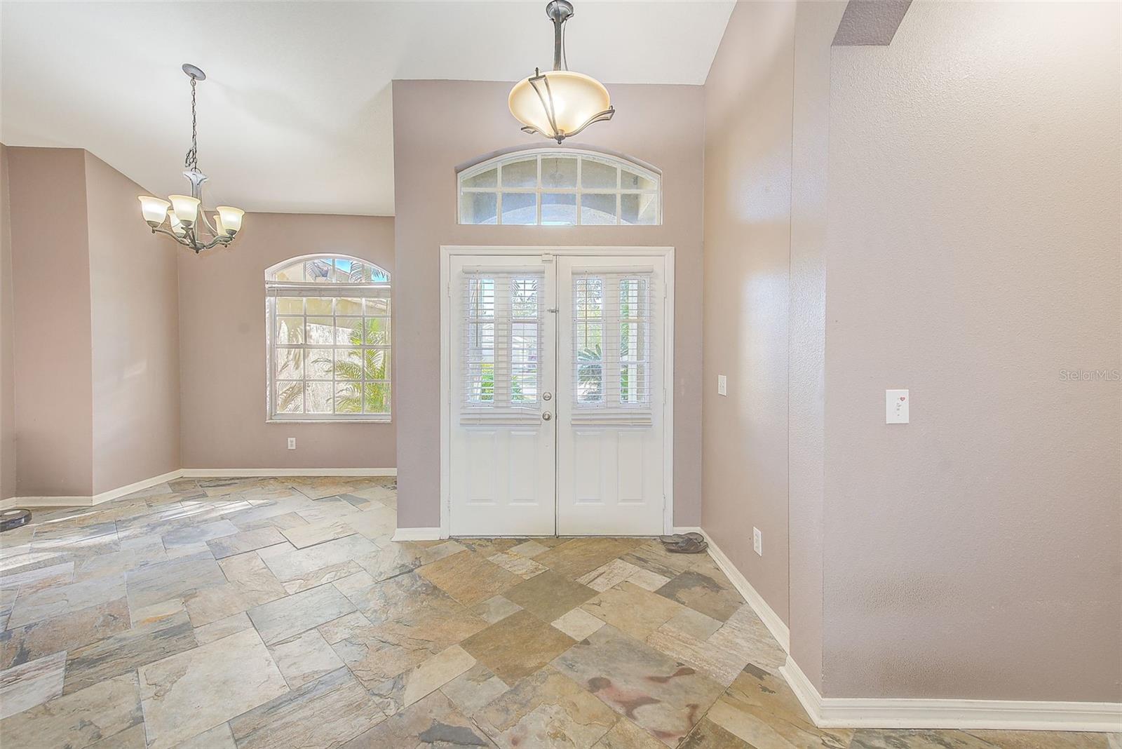 FORMAL LIVING ROOM TO FOYER & FORMAL DINING ROOM