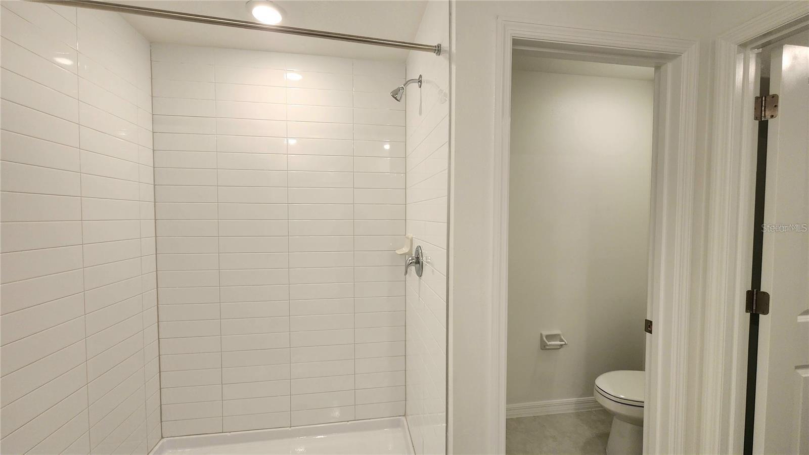 Primary Walk In Shower and Private Water Closet