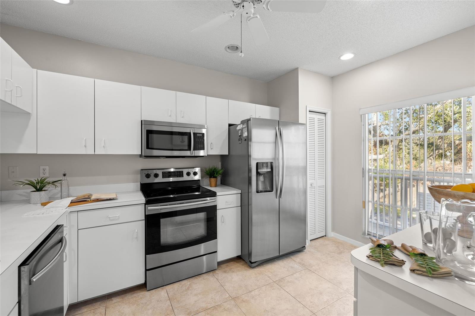 Ideal kitchen layout with ss appliances and cabinet pantry